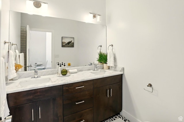 2237 N 450 W, Layton, UT 84041 - full bathroom featuring toilet, baseboards, double vanity, and a sink