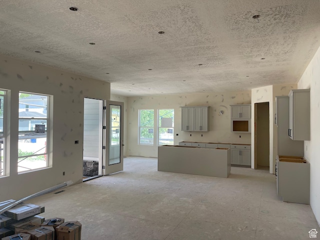 3724 S 5450 W Unit 12, West Valley City, UT 84120 - unfurnished living room featuring a textured ceiling