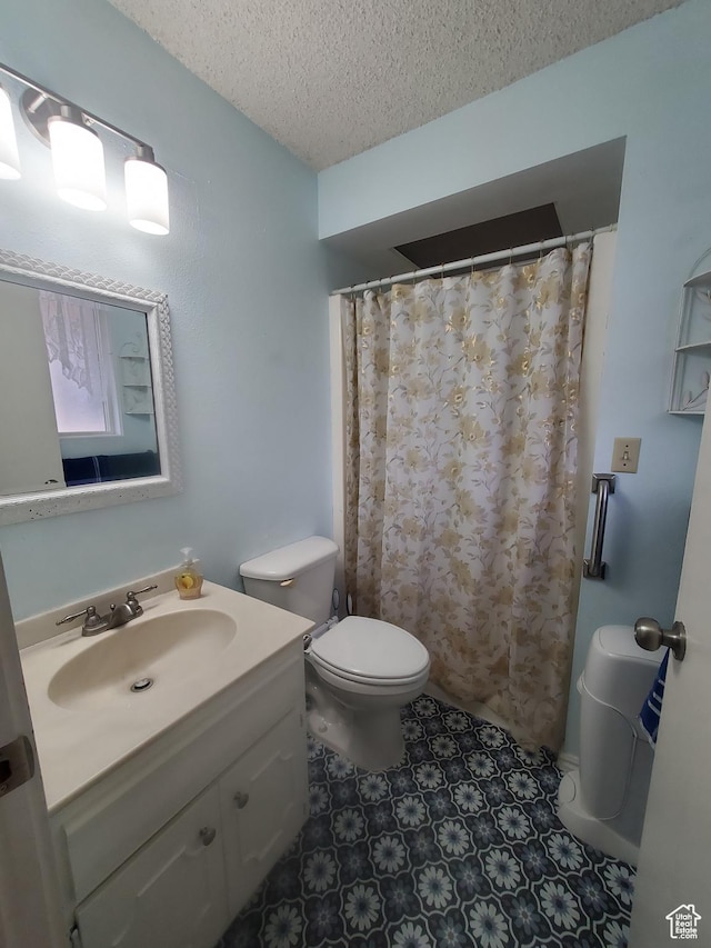 350 N 3rd St, Montpelier, ID 83254 - full bath featuring a textured ceiling, toilet, and vanity