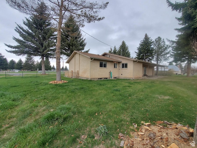 350 N 3rd St, Montpelier, ID 83254 - rear view of house featuring brick siding