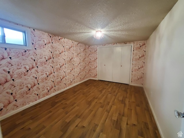 350 N 3rd St, Montpelier, ID 83254 - unfurnished bedroom with baseboards, a textured ceiling, and wood finished floors