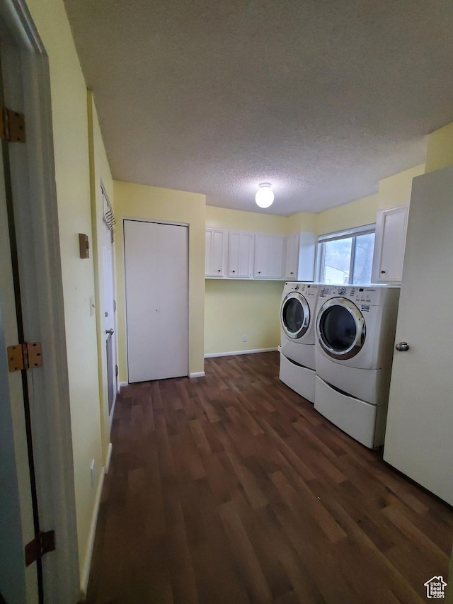350 N 3rd St, Montpelier, ID 83254 - clothes washing area featuring cabinet space, washing machine and dryer, dark wood finished floors, baseboards, and a textured ceiling