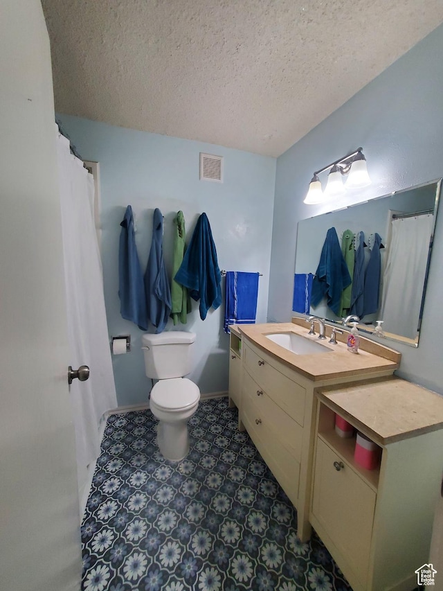 350 N 3rd St, Montpelier, ID 83254 - full bathroom featuring a textured ceiling, toilet, vanity, and baseboards