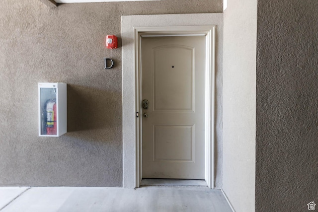 doorway to property with stucco siding