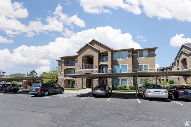 view of property featuring covered parking