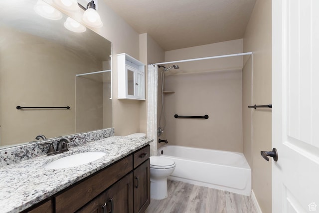 full bathroom featuring toilet, vanity, shower / bathing tub combination, and wood finished floors
