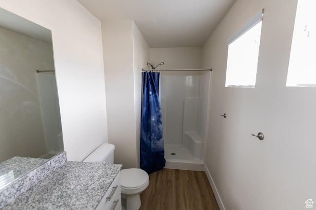 987 W 600 S, Brigham City, UT 84302 - full bath featuring toilet, wood finished floors, vanity, curtained shower, and baseboards