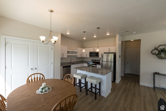 987 W 600 S, Brigham City, UT 84302 - dining area featuring recessed lighting, a chandelier, visible vents, and dark wood-type flooring