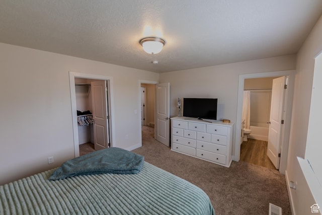 987 W 600 S, Brigham City, UT 84302 - carpeted bedroom featuring a closet, visible vents, a spacious closet, connected bathroom, and baseboards