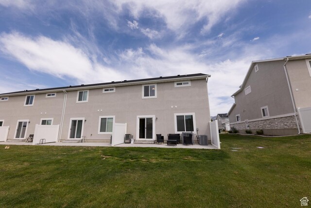 987 W 600 S, Brigham City, UT 84302 - back of house with a patio area, stucco siding, central AC, and a lawn