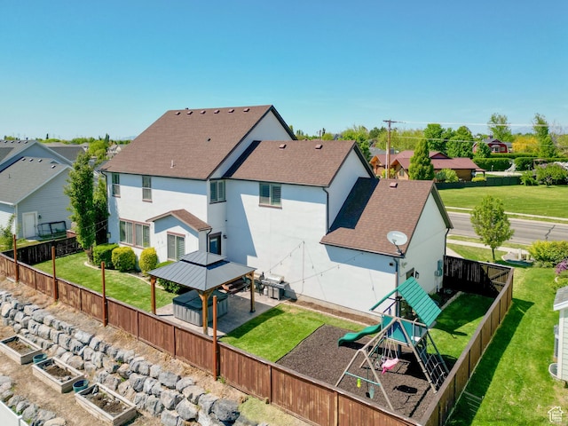 1827 W Burke Ln, Farmington, UT 84025 - rear view of property with a playground, stucco siding, a gazebo, roof with shingles, and a fenced backyard