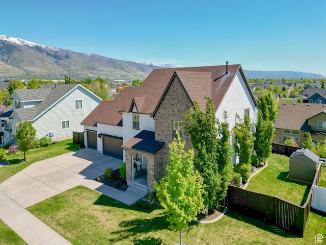 1827 W Burke Ln, Farmington, UT 84025 - exterior space featuring driveway, a mountain view, fence, an attached garage, and a residential view