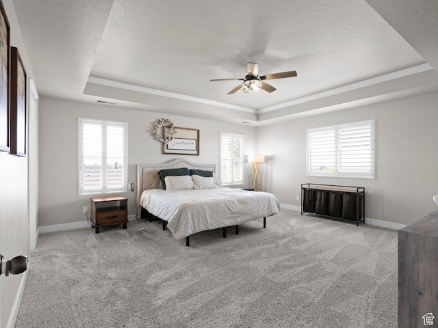 1827 W Burke Ln, Farmington, UT 84025 - carpeted bedroom with ceiling fan, baseboards, a raised ceiling, and ornamental molding