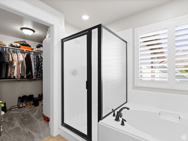 1827 W Burke Ln, Farmington, UT 84025 - full bathroom with a stall shower, a walk in closet, a bath, and recessed lighting