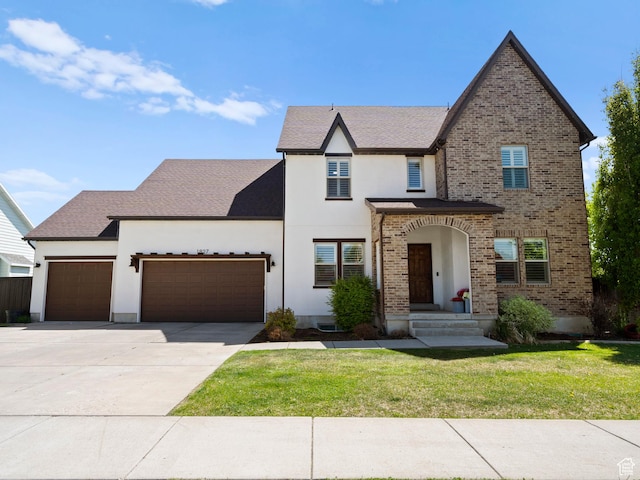 1827 W Burke Ln, Farmington, UT 84025 - view of front of house featuring driveway, stucco siding, a garage, and a front yard