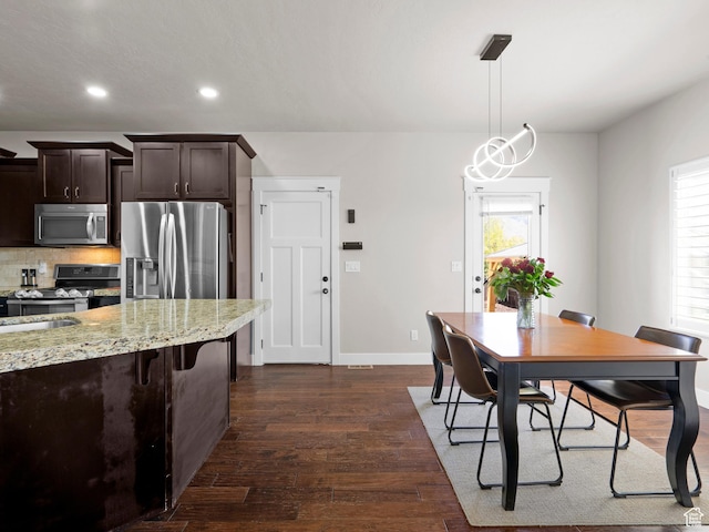 1827 W Burke Ln, Farmington, UT 84025 - dining room featuring recessed lighting, baseboards, a healthy amount of sunlight, and dark wood finished floors