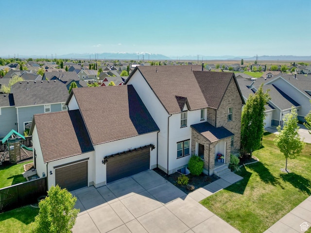 1827 W Burke Ln, Farmington, UT 84025 - view of front of home with driveway, stucco siding, a residential view, and a garage