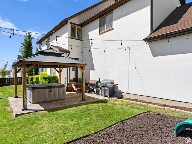 1827 W Burke Ln, Farmington, UT 84025 - back of house with a yard, a hot tub, fence, a patio, and a gazebo