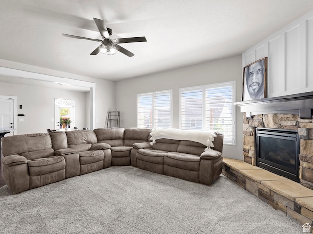 1827 W Burke Ln, Farmington, UT 84025 - carpeted living area featuring a ceiling fan, a wealth of natural light, and a fireplace