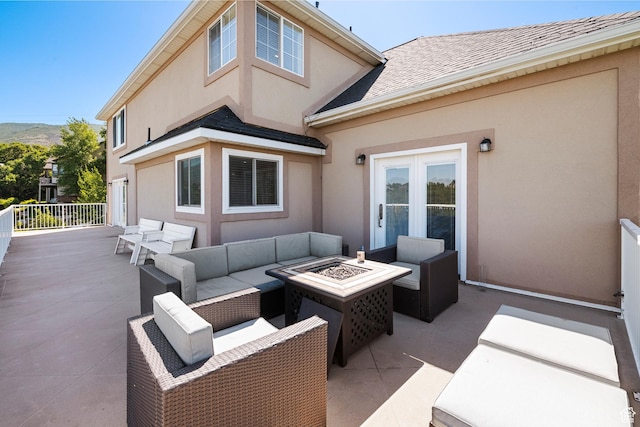 2247 Country Oaks Dr, Layton, UT 84040 - view of patio with an outdoor living space with a fire pit and french doors
