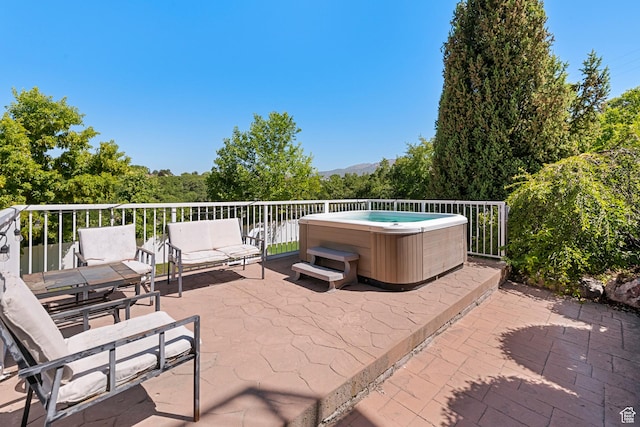 2247 Country Oaks Dr, Layton, UT 84040 - view of patio / terrace featuring a hot tub and a mountain view