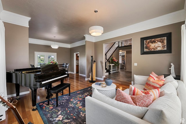 2247 Country Oaks Dr, Layton, UT 84040 - living area with crown molding, wood finished floors, and stairway
