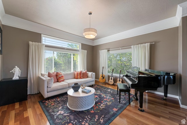 2247 Country Oaks Dr, Layton, UT 84040 - living area with crown molding, wood finished floors, and a textured ceiling