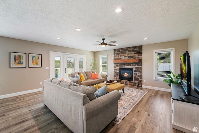 2247 Country Oaks Dr, Layton, UT 84040 - living area with a textured ceiling, light wood-type flooring, ceiling fan, plenty of natural light, and recessed lighting