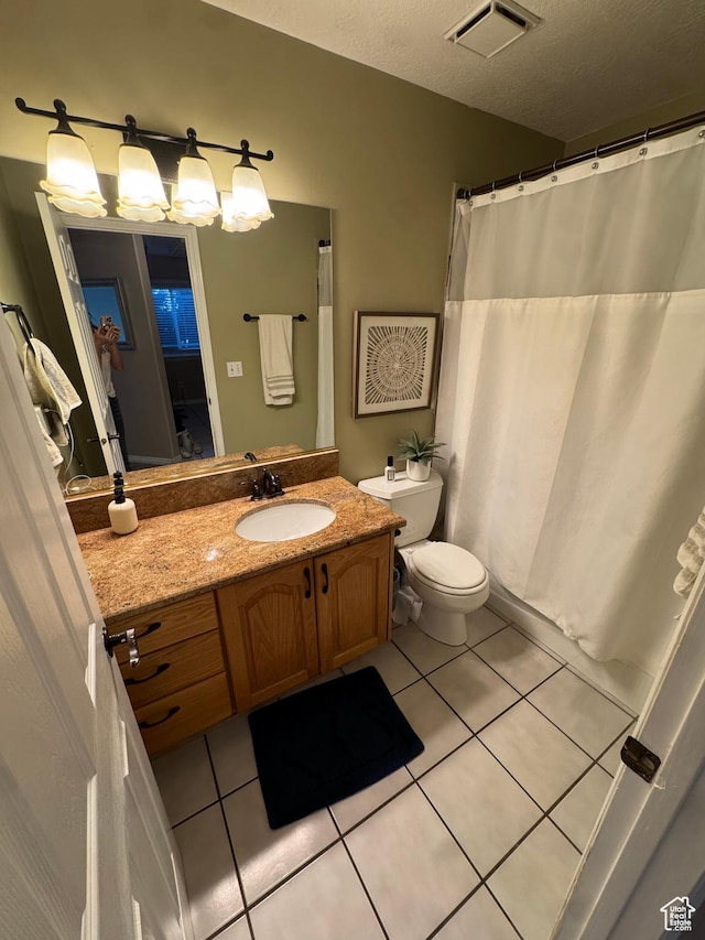 2247 Country Oaks Dr, Layton, UT 84040 - bathroom with toilet, tile patterned floors, curtained shower, visible vents, and vanity