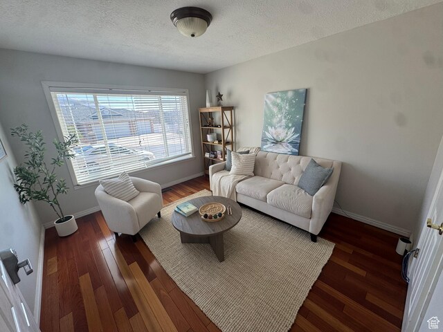 2247 Country Oaks Dr, Layton, UT 84040 - living area with a textured ceiling, baseboards, and wood finished floors