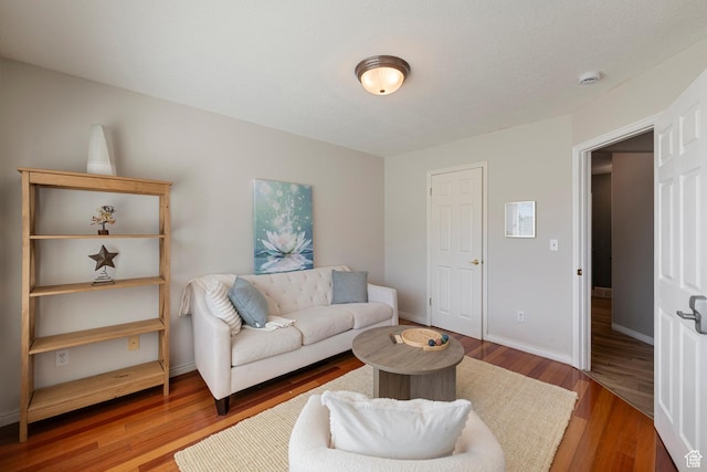 2247 Country Oaks Dr, Layton, UT 84040 - living area featuring wood finished floors and baseboards