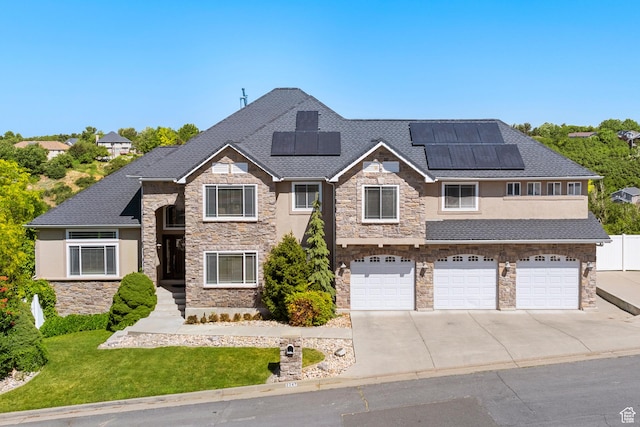2247 Country Oaks Dr, Layton, UT 84040 - view of front of house with stone siding, concrete driveway, a garage, and a shingled roof
