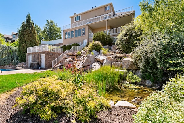 2247 Country Oaks Dr, Layton, UT 84040 - back of property with stairs and an outdoor pool