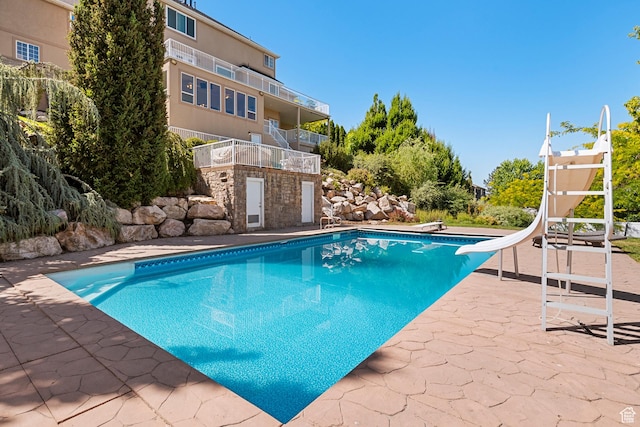 2247 Country Oaks Dr, Layton, UT 84040 - swimming pool with a diving board, a patio, and a water slide