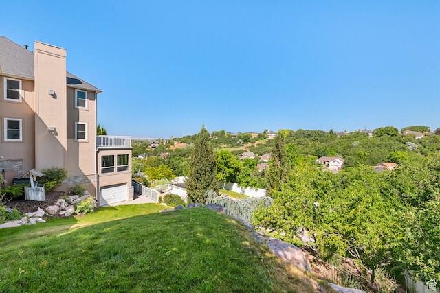 2247 Country Oaks Dr, Layton, UT 84040 - view of grassy yard featuring a balcony and a garage
