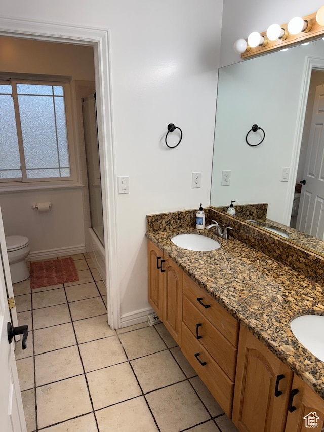 2247 Country Oaks Dr, Layton, UT 84040 - full bath featuring double vanity, toilet, a sink, tile patterned flooring, and baseboards