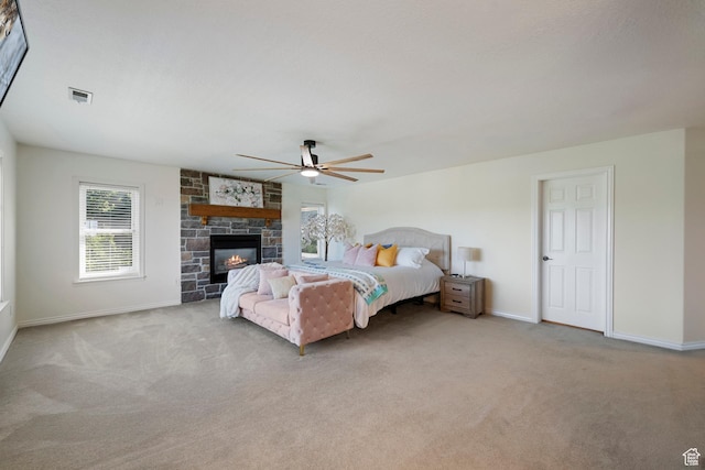2247 Country Oaks Dr, Layton, UT 84040 - bedroom with carpet floors, ceiling fan, and a stone fireplace