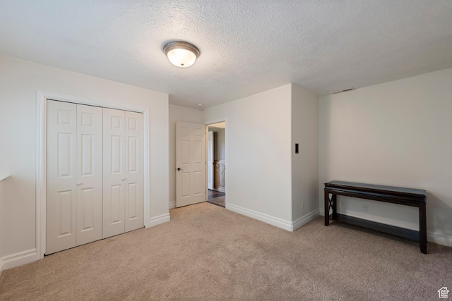 2247 Country Oaks Dr, Layton, UT 84040 - unfurnished bedroom featuring carpet flooring, a textured ceiling, and a closet