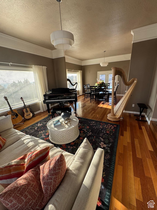2247 Country Oaks Dr, Layton, UT 84040 - living room featuring ornamental molding, a textured ceiling, and wood finished floors