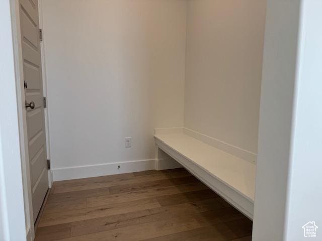 mudroom featuring baseboards and light wood-style floors