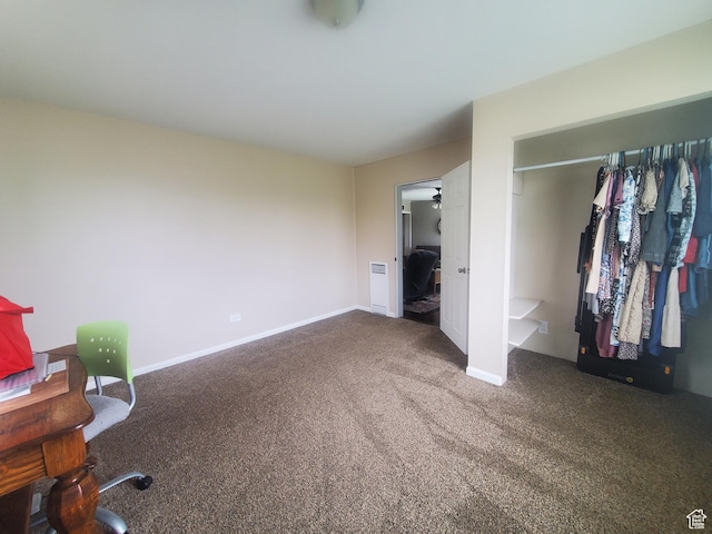 unfurnished bedroom with baseboards, carpet flooring, and a closet