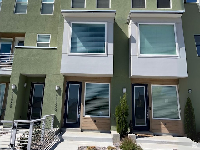 rear view of property with stucco siding