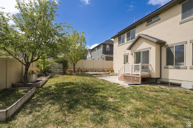235 E Caracara St S, Saratoga Springs, UT 84043 - view of yard featuring a vegetable garden and a fenced backyard