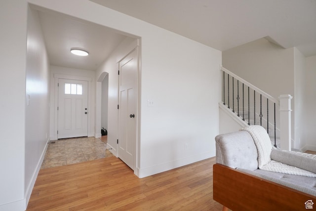 235 E Caracara St S, Saratoga Springs, UT 84043 - foyer with stairs, baseboards, and light wood-style floors