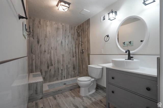 235 E Caracara St S, Saratoga Springs, UT 84043 - full bath featuring toilet, tiled shower, vanity, and wood finished floors