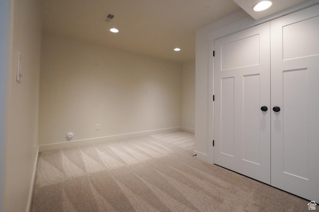 235 E Caracara St S, Saratoga Springs, UT 84043 - unfurnished bedroom featuring light colored carpet, a closet, baseboards, and recessed lighting