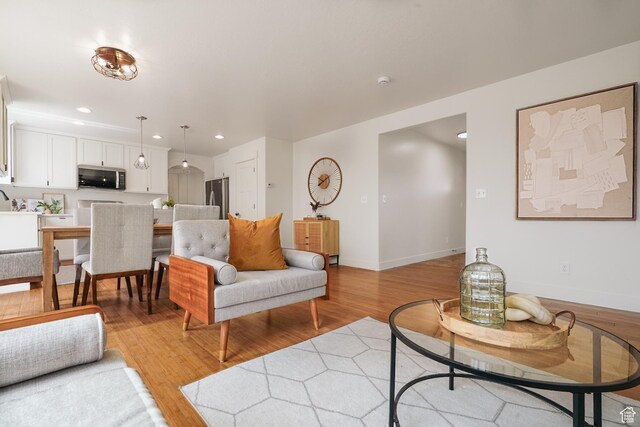 235 E Caracara St S, Saratoga Springs, UT 84043 - living area with light wood-style floors, baseboards, and recessed lighting