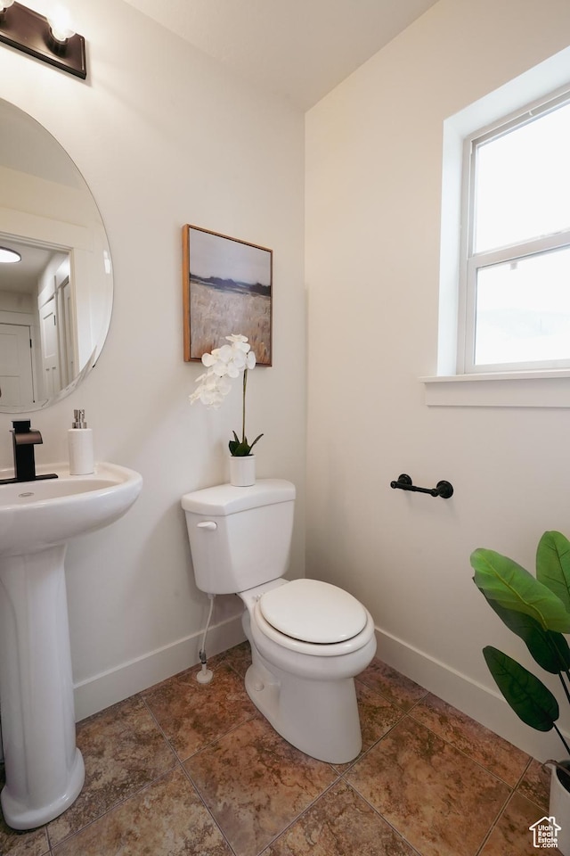 235 E Caracara St S, Saratoga Springs, UT 84043 - bathroom with toilet, baseboards, and a sink