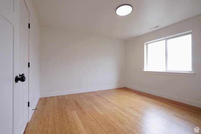 235 E Caracara St S, Saratoga Springs, UT 84043 - unfurnished room featuring baseboards, light wood-style flooring, and visible vents