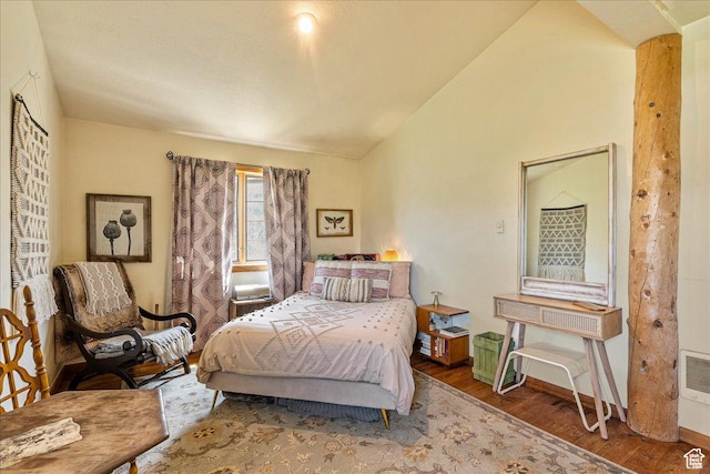 1071 S Foothill Dr E Unit 1, Kamas, UT 84036 - bedroom with vaulted ceiling, wood finished floors, and baseboards